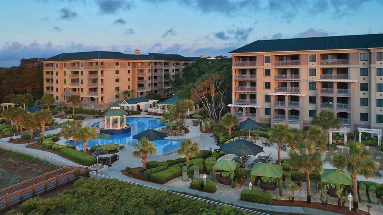 Exterior of Marriott's Barony Beach Club timeshare location showing pool pergola